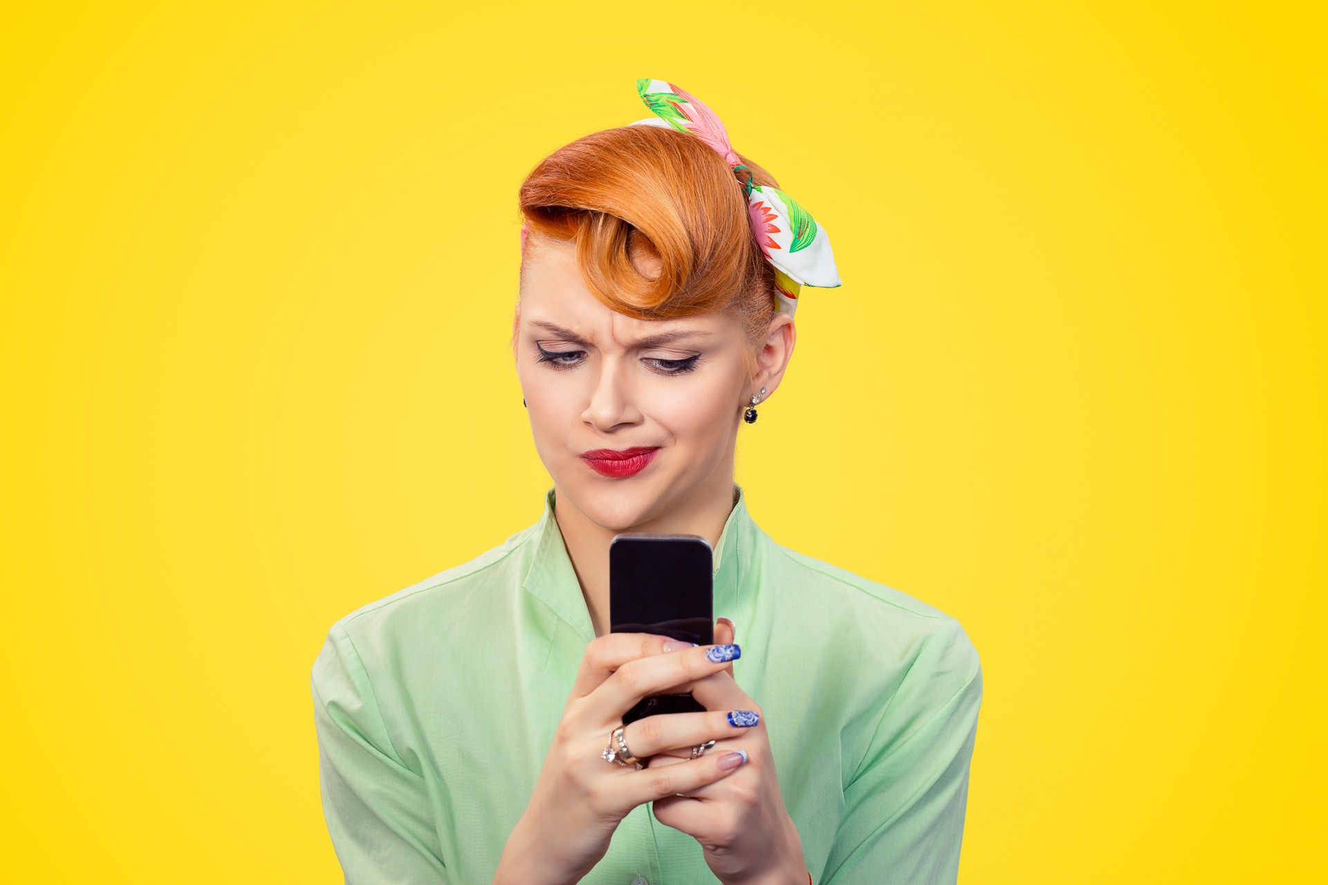 unhappy serious woman looking at texting on phone displeased with conversation